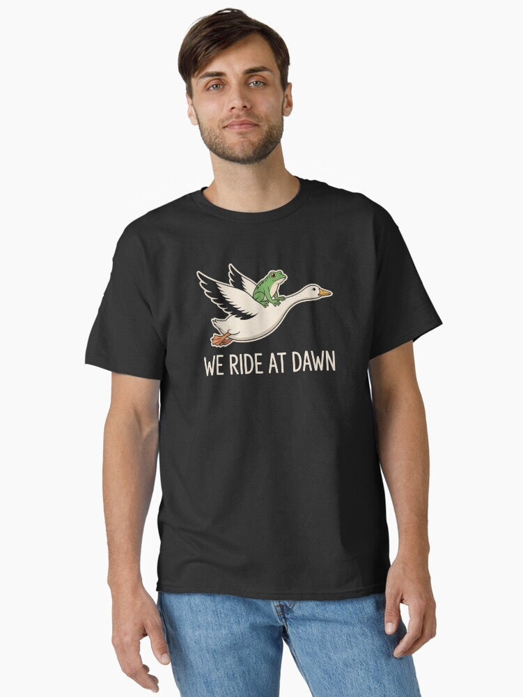We Ride at Dawn Frog Riding Goose Whimsical Cottagecore Animal Meme Shirt Classic T-Shirt | Premium Unisex T-Shirt, Trending Graphic Tee