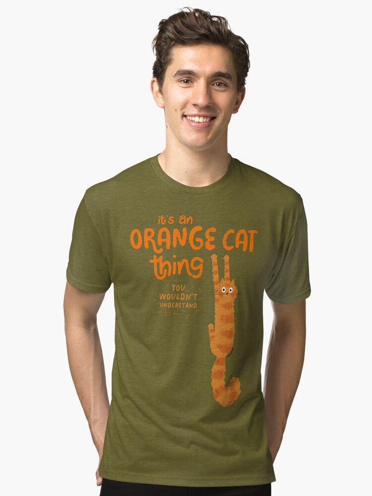 It s An Orange Cat Thing Funny Tabby Cat Holding On with Claws Tri blend T Shirt T Shirt Trending US Daily Wear